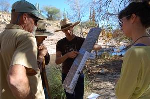 WMG's Policy &amp; Technical Director Catlow Shipek, center, along with WMG's River Restoration Biologist Trevor Hare (far left), Van Clothier with Stream Dynamics and a volunteer (right) are reviewing opportunities and strategies to restore lower Sabino Creek.