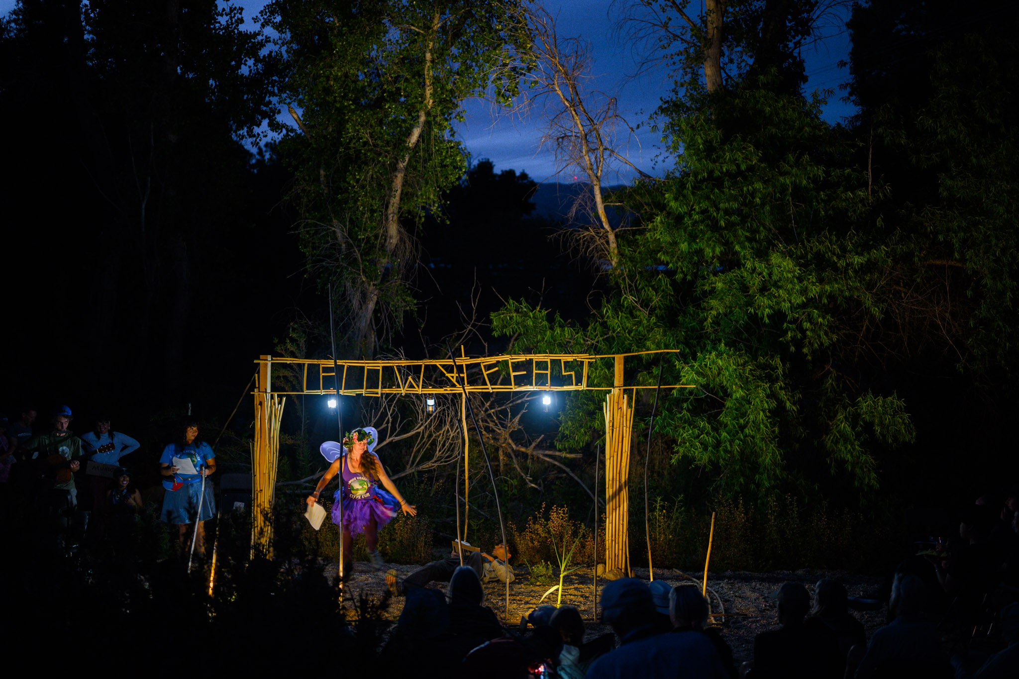 Performers on an outdoor stage acting in Arundo, The Musical