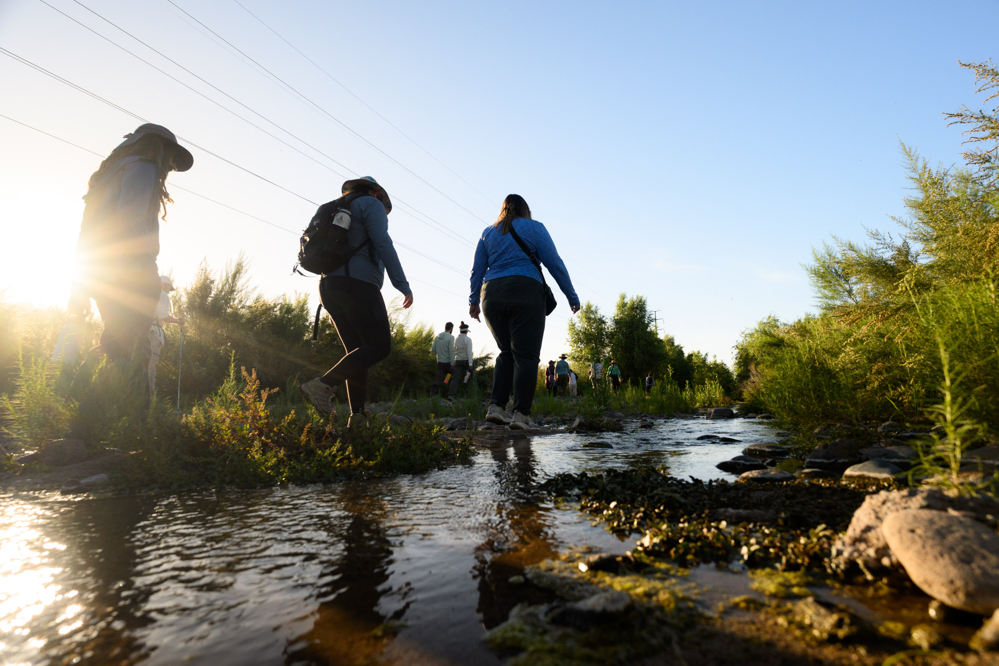 people walking in river flow