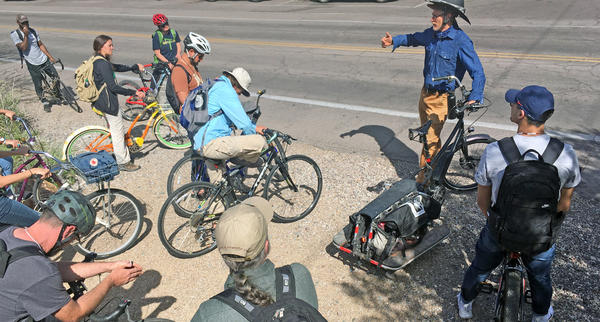 Course participants prepare to head out on a bike tour with author and instructor Brad Lancaster