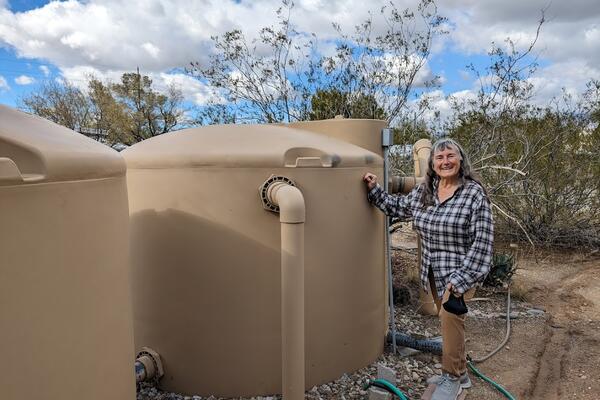 Catherine with her Rainwater Tanks