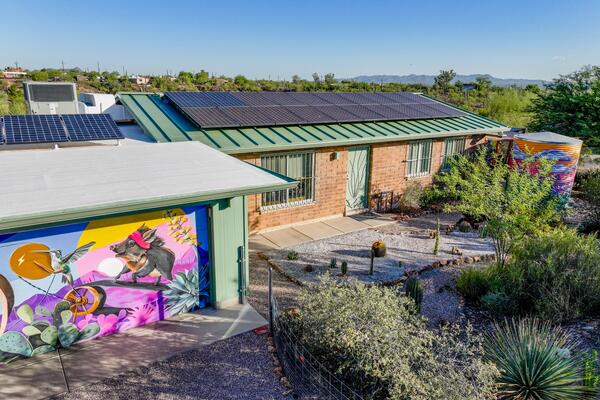 Front of David's home View of murals, rain garden, cactus garden and rainwater tank.
