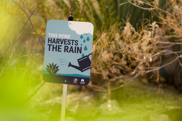 Image of sign that says this home harvests the rain Image of sign that says this home harvests the rain