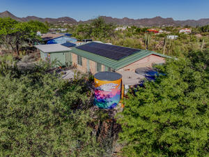 view of rainwater tank and solar panels. 