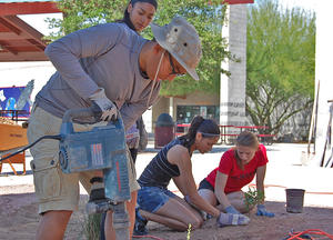 Students constructing schoolyard rain garden