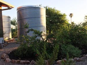 Waterharvesting cistern and earthworks at a Tucson home.