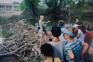 Sandy Anderson, director of Gray Hawk Nature Center, shows school kids a beaver dam on the San Pedro River in 2004. Courtesy of Sandy Anderson