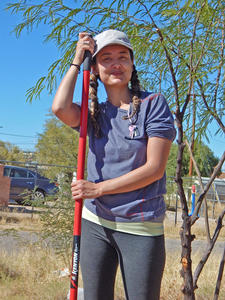 Steward In Place - Volunteer holding shovel