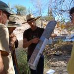 WMG's Policy & Technical Director Catlow Shipek, center, along with WMG's River Restoration Biologist Trevor Hare (far left), Van Clothier with Stream Dynamics and a volunteer (right) are reviewing opportunities and strategies to restore lower Sabino Creek.