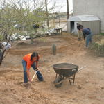 Volunteers dig basins