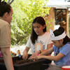 two girls learning about compost and soil at the Living Lab