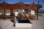 Karilyn Roach shows off the 10,000 gallon underground cistern. Photo: Mamta Popat